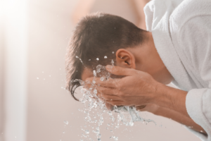 Washing face with cold water