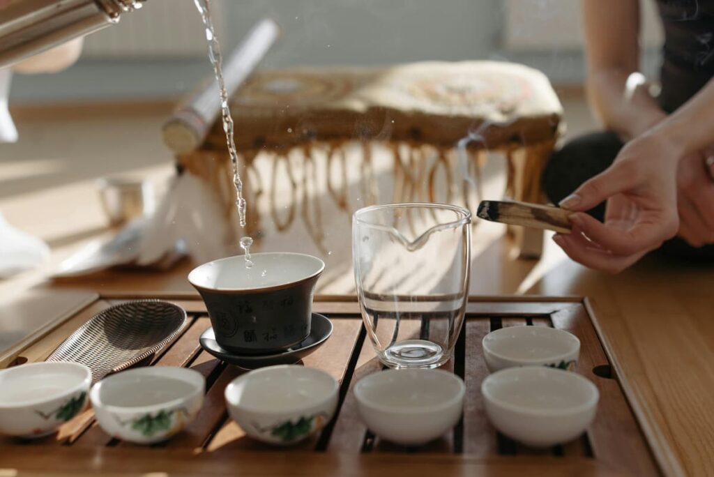 Pouring hot water into a glass cup
